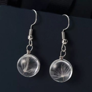 Oorbel bloem paardenbloem pluisje stock